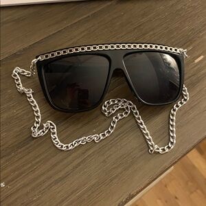 Find glasses with silver and gold chain.